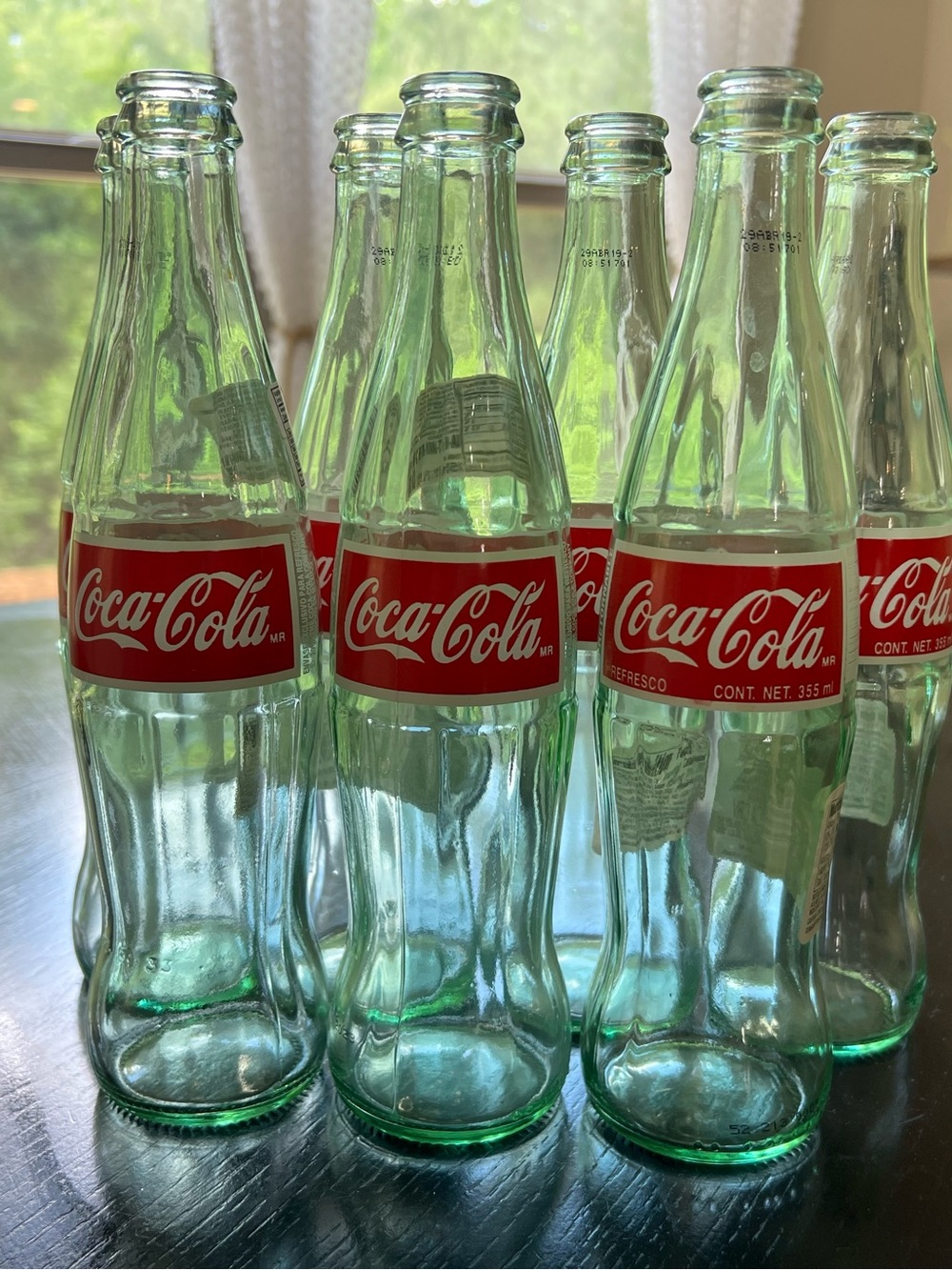 7 Antique Coca-Cola glass bottles